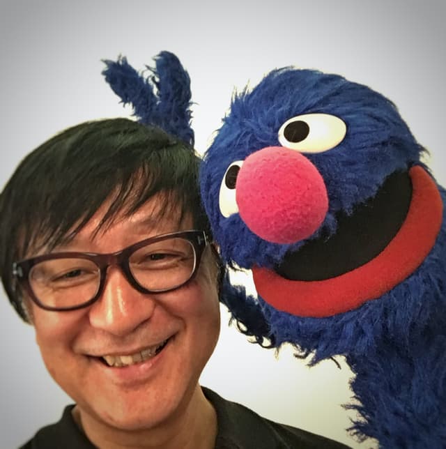 Manabu Nagaoka with Grover from Sesame Street